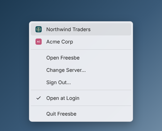 The tray menu: Northwind Traders and Acme Corp with their logos, then Open Freesbe, Change Server, Sign Out, Open at Login and Quit Freesbe